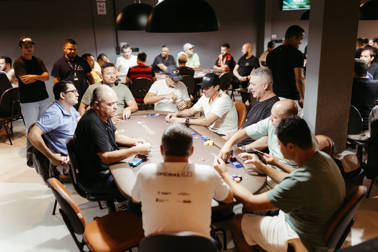 Vibrant scene of a poker tournament with players intensely focused, showcasing the dynamic atmosphere of casino gaming.